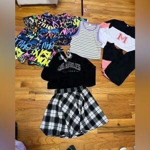 Bundle summer clothes sizes 10-14 in girls some never used . Selling as it is .
